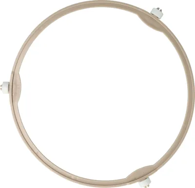 A circular beige turntable ring with three white plastic feet, isolated on a white background.
