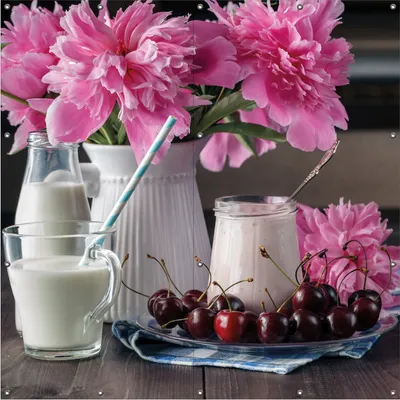 Produktbild von Wallario Outdoor-Poster für Garten oder Balkon, Motiv Milch mit Kirschen zum Frühstück mit rosa Blumenarrangement, in ca. 180 x 180 cm