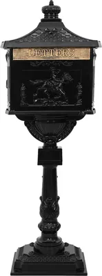A black cast iron mailbox on a pedestal, isolated on a white background.