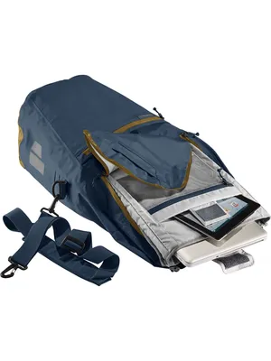 A blue backpack is shown with its main compartment open, revealing a laptop and other items inside.