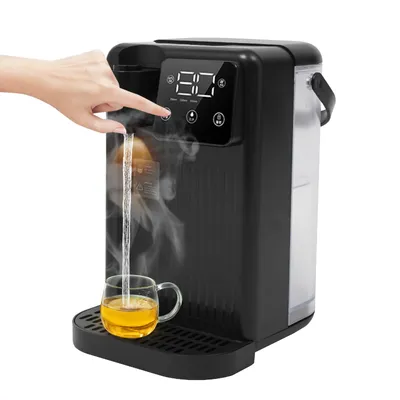 A person's hand is shown pressing a button on a black electric water dispenser. Hot water is pouring from the dispenser into a clear glass cup filled with amber liquid, likely tea. Steam rises from the cup and the dispenser.