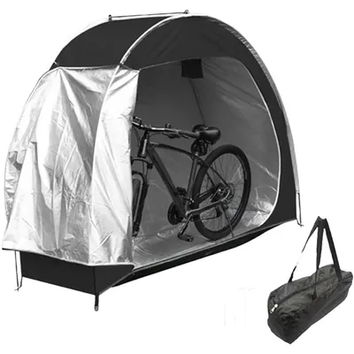 A bicycle stored inside a portable outdoor garage tent.
