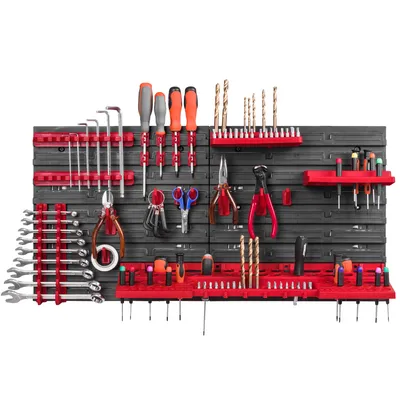 A well-organized tool wall with various tools neatly arranged on red and black holders.