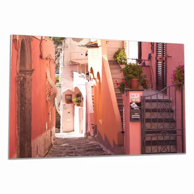 Produktbild von Wallario Herdabdeckplatte aus Glas, Größe 80 x 52 cm 1-teilig, Motiv Südländische Gasse- Italien bei Sonnenschein