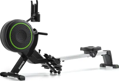 A black rowing machine with green accents, shown in a studio setting against a white background.