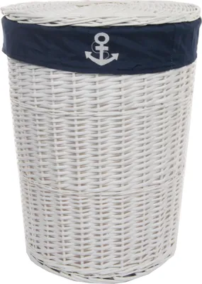 A white wicker laundry basket with a navy blue fabric band and an anchor design.