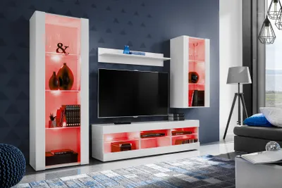 A modern living room with a wall-mounted entertainment unit featuring a TV, shelves, and cabinets illuminated with red LED lights.