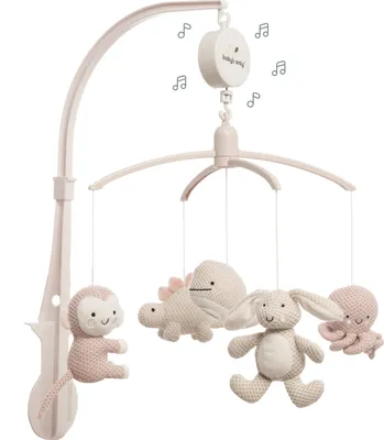 A baby mobile with stuffed animal toys hanging from it.