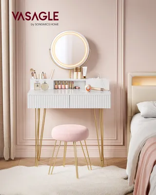 A vanity table with a stool and mirror in a bedroom setting.