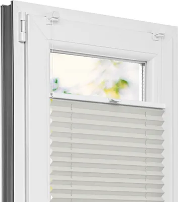 A close-up view of a white pleated blind installed on a white window frame.
