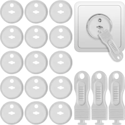 A collection of white plastic socket covers and a white plastic key for removing them, shown against a white background. A single socket cover is shown inserted into a white electrical socket.
