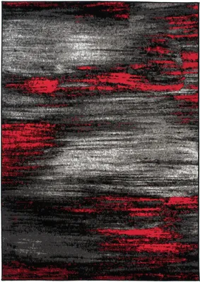 A close-up, abstract view of a rug with a distressed, textured pattern.