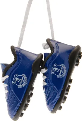 A pair of miniature blue football boots with the Everton FC logo, hanging by white laces.