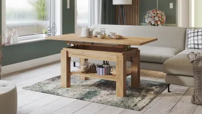 A living room scene with a coffee table that can be extended and raised, a sofa, and a window.