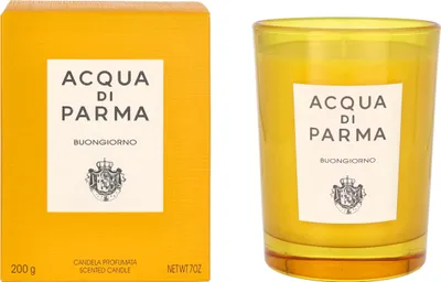 A product shot of a scented candle and its packaging.