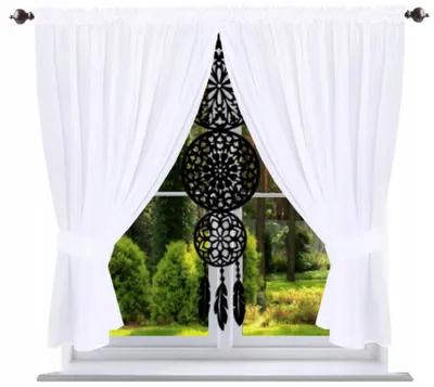 A white voile curtain is shown draped over a window, with a black dreamcatcher hanging in the center.