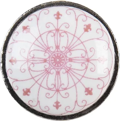 A close-up, top-down view of a single decorative knob.