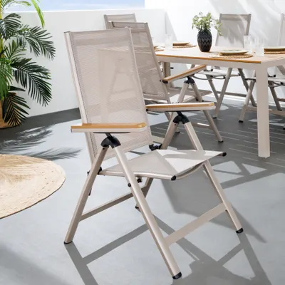 Outdoor patio furniture set with chairs and a table on a balcony.