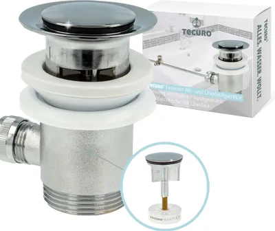 A product shot of a sink drain assembly with packaging in the background.
