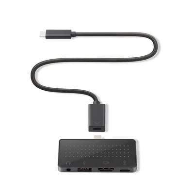 A black USB-C hub with multiple ports and a connected USB-C cable is shown against a white background.