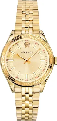 A close-up studio shot of a gold-colored Versace watch.