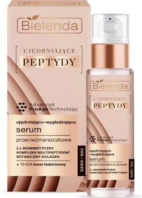 A product shot of a skincare serum bottle and its packaging.