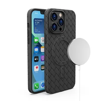 A black iPhone 15 Pro Max with a woven case and a MagSafe charger.