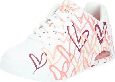 A white sneaker with a heart pattern.