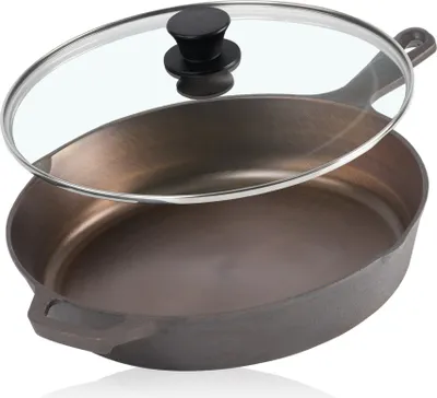 A cast iron frying pan with a glass lid, shown from a slightly elevated angle against a white background.