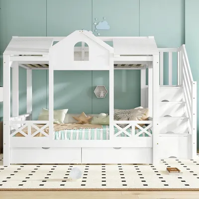 A white house-shaped bunk bed with stairs and drawers, set against a light blue wall.