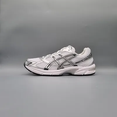 A single white and silver Asics running shoe is shown against a plain gray background.