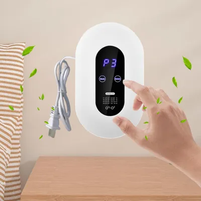 A hand is shown interacting with a white wall-mounted air purifier, with green leaves floating around it, suggesting air purification.