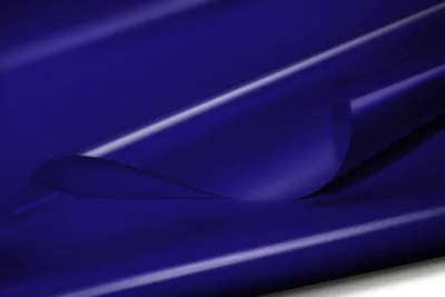 A close-up, studio shot of a blue PVC tarpaulin material, with one corner folded over to reveal the underside.