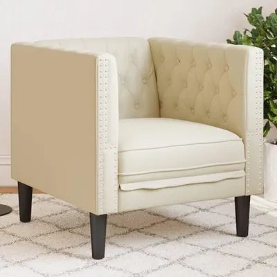 Immagine prodotto di Poltrona Chesterfield color crema, rivestita in ecopelle, con seduta imbottita e gambe robuste, ideale per il soggiorno o l'ufficio