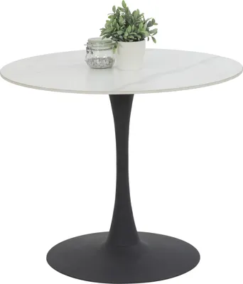 A round dining table with a white marble-look top and a black trumpet base, shown on a white background with a small potted plant and a jar on top.