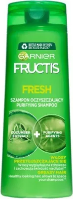 A green bottle of Garnier Fructis Fresh Purifying Shampoo for greasy hair.