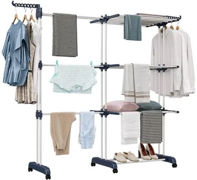 Zdjęcie produktu dla Uniqoos® Elastyczny wieszak na pranie z wysuwanymi ramionami – regulowany zakres 66–130 cm, udźwig 40 kg, 6 kółek z hamulcem, stal nierdzewna i tworzywo sztuczne, do użytku wewnątrz i na zewnątrz