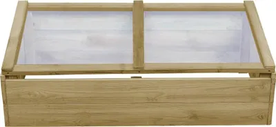 A wooden cold frame with a transparent lid.