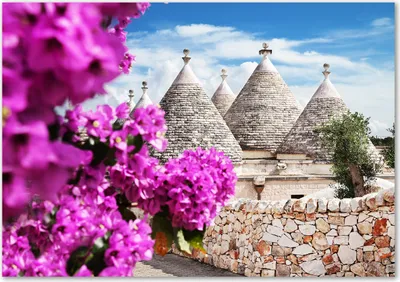 Produktbild von Tulup® Leinwandbild - 100x70 cm - Wandkunst - Drucke auf Leinwand - Leinwanddruck  - Sehenswürdigkeiten & Architektur - Rosa - Trulli Häuser