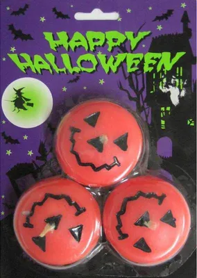 A package of three Halloween-themed pumpkin-shaped candles.