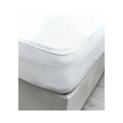A close-up view of a white mattress protector on a bed.