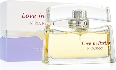 A bottle of Nina Ricci Love In Paris Eau de Parfum and its packaging.