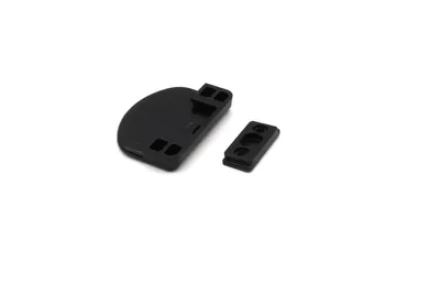 Two black plastic components for a window or door handle are shown on a white background.