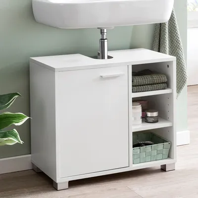 A white vanity cabinet under a sink.