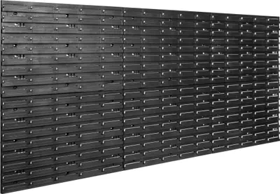 A wall of black plastic storage modules, likely for organizing tools or small items.