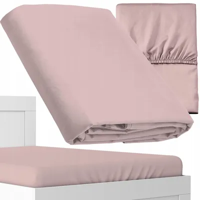 A pink fitted sheet is shown folded and on a mattress.