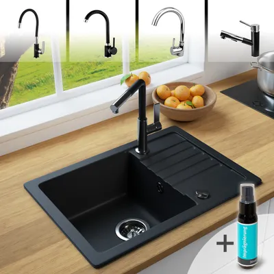 A kitchen sink setup with multiple faucet options displayed in the background, along with a bowl of oranges and a cleaning spray bottle.