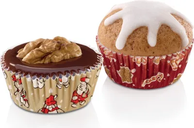 Two muffins in festive paper liners, one topped with chocolate and a walnut, the other with white icing.