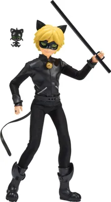 A doll of the character Cat Noir from Miraculous Ladybug, holding his staff, with a small figure of Plagg beside him.