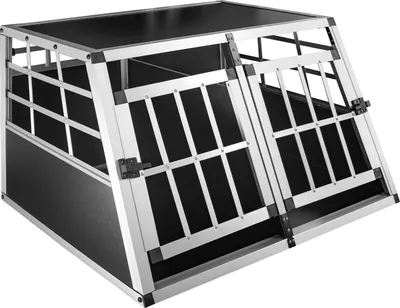 A dog crate made of aluminum and black panels, shown from a slightly elevated front-left angle.
